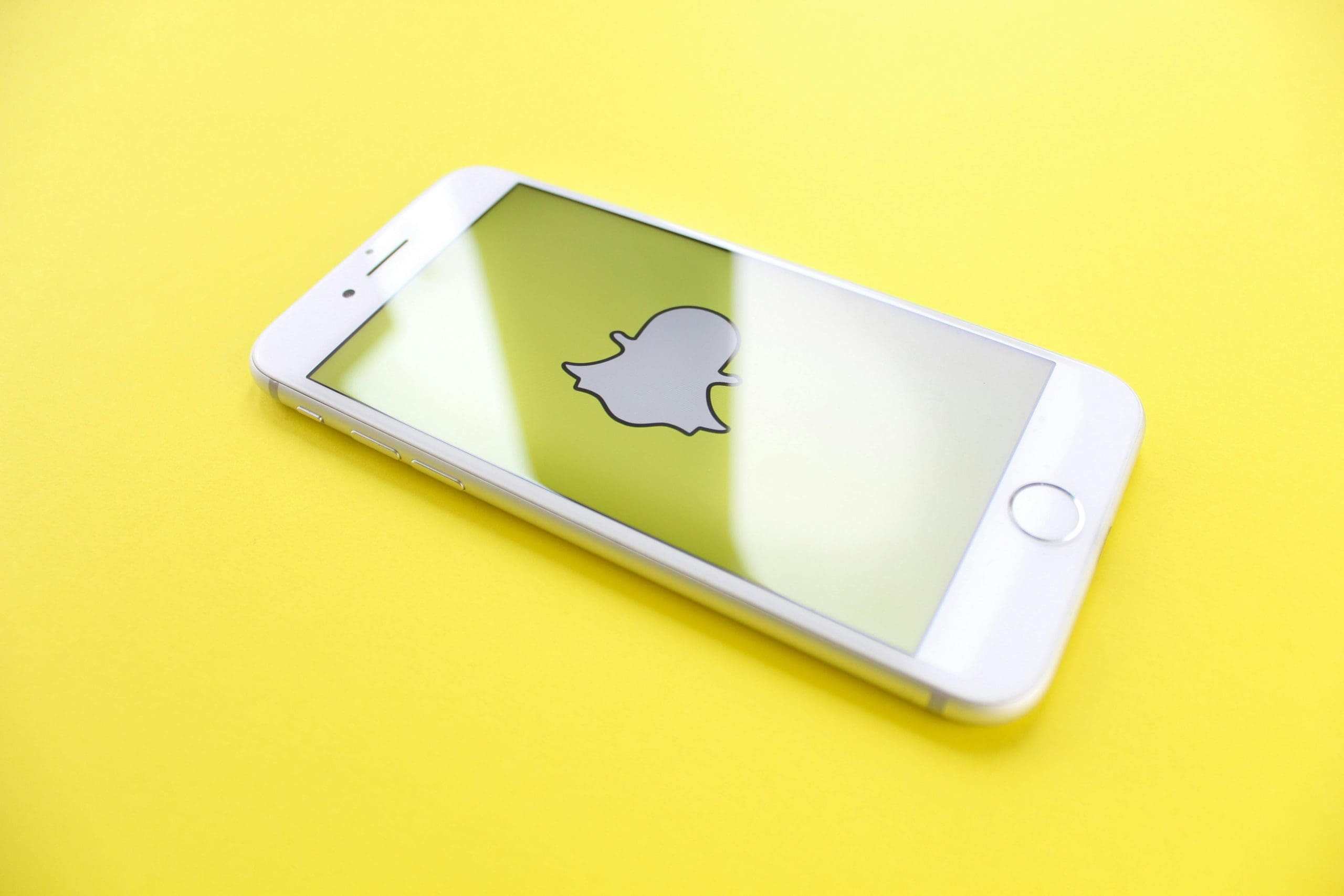 snapchat ads logo on phone